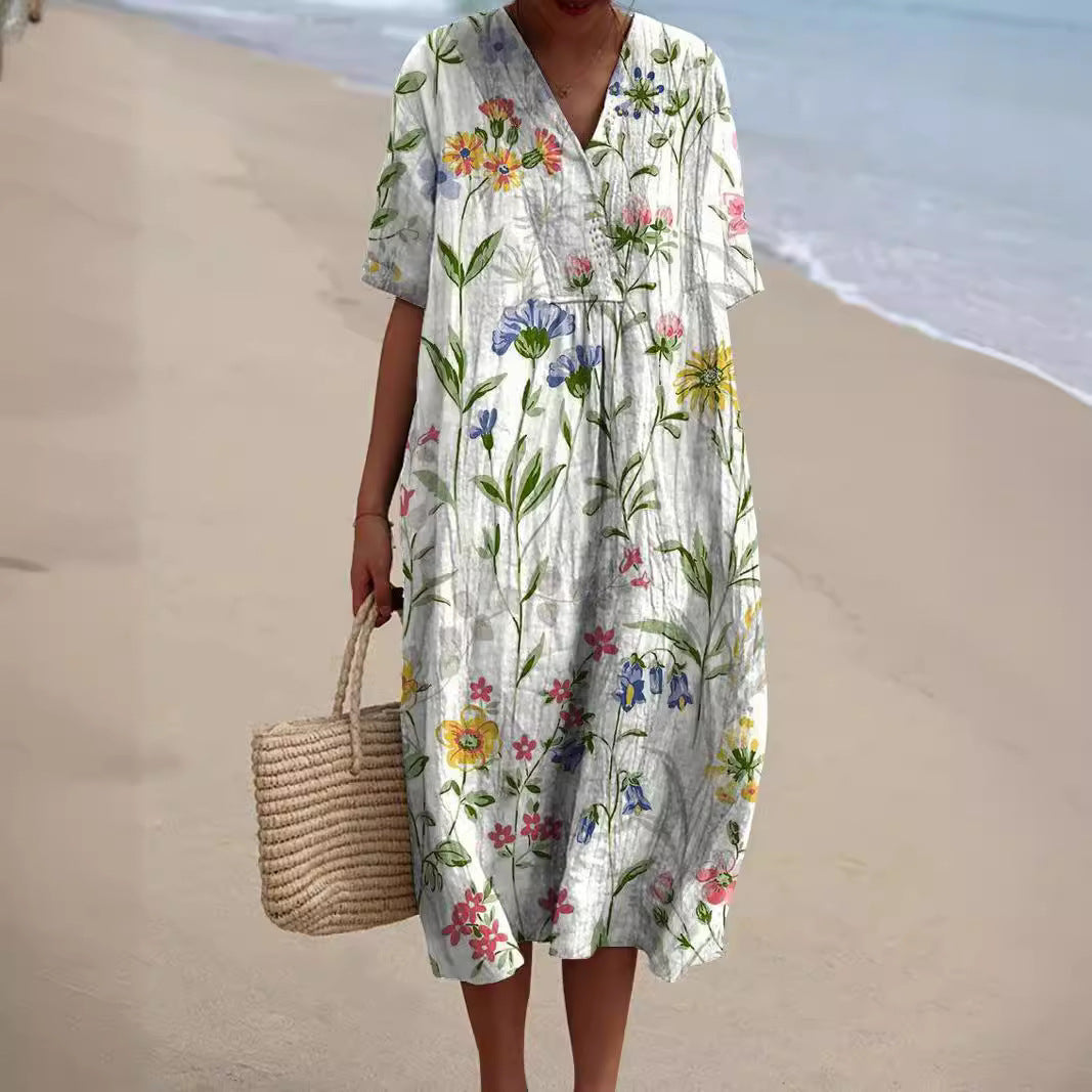 Robe midi femme imprimé floral fond blanc, col chemise boutonné, coupe ample, manches courtes