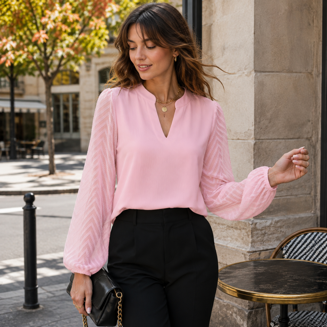 Blouse rose à manches bouffantes chevron et col V fendu, pantalon noir