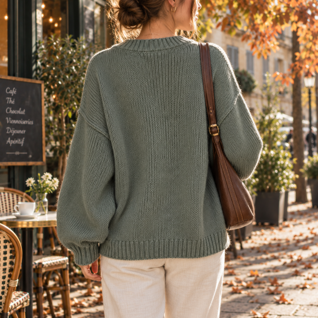 Dos du cardigan vert en maille unie avec bord côtelé et manches ballon