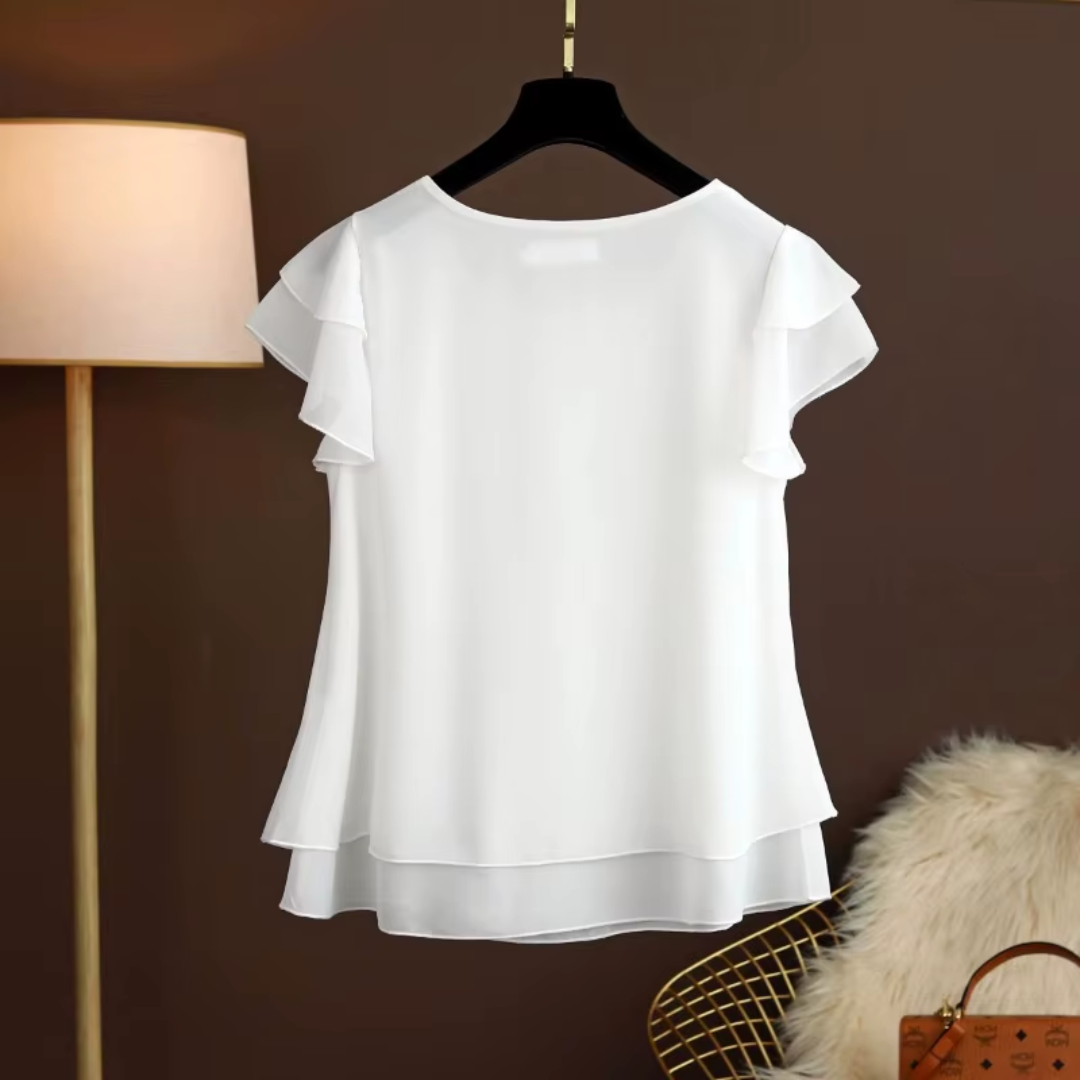 Blouse blanche femme col rond avec double volant sur les manches, sur cintre