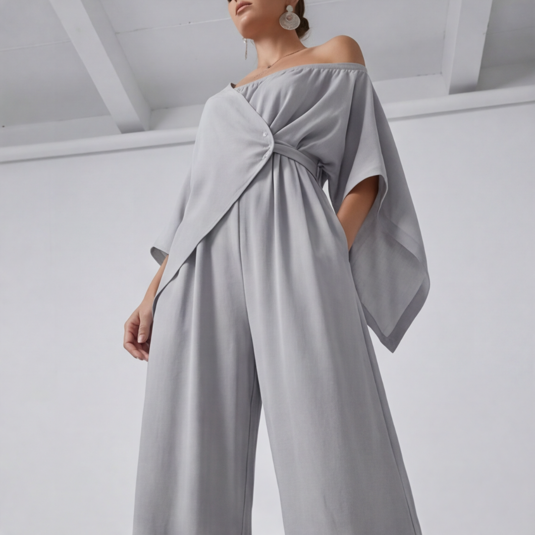 Combinaison femme gris détail nœud et boutons décoratifs sur buste