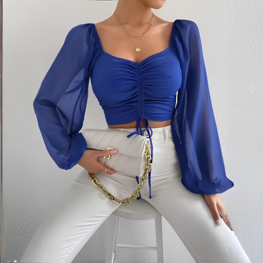 Crop top bleu vif manches longues transparentes et fronces centrales lacées