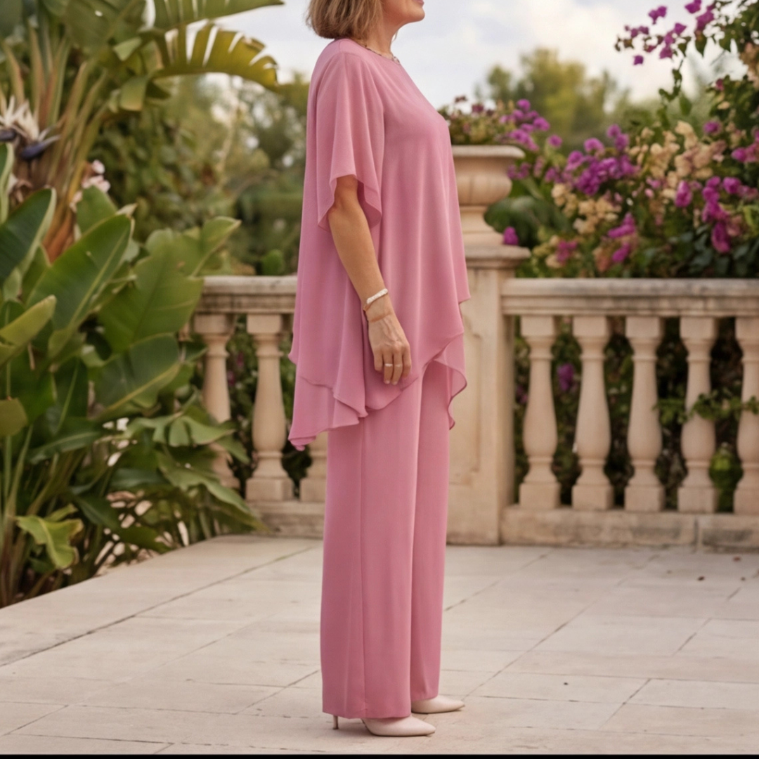 Ensemble femme rose vue de trois quarts top voilé asymétrique pantalon palazzo fluide
