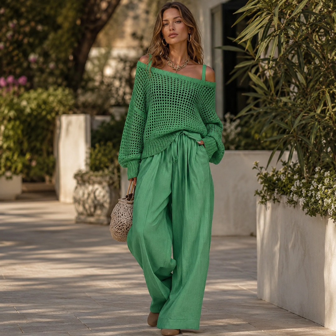 Ensemble vert porté en pied, pull en maille et pantalon large assortis