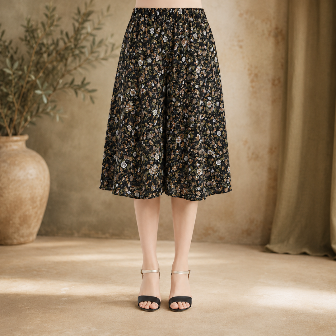 Jupe-culotte noire à petit imprimé floral vert et brun, tombé fluide