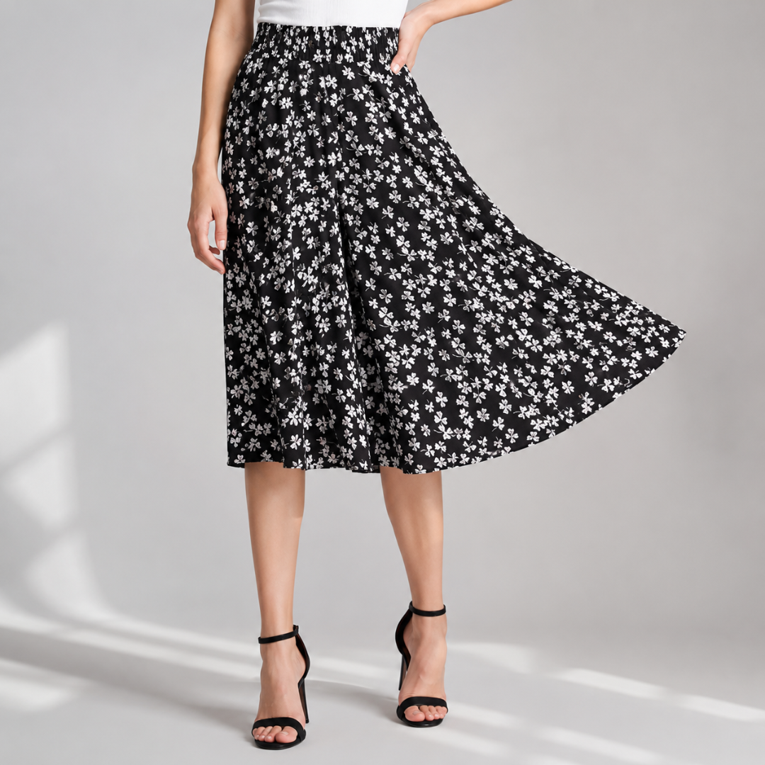 Jupe-culotte noire à petites fleurs blanches, taille haute et mouvement fluide