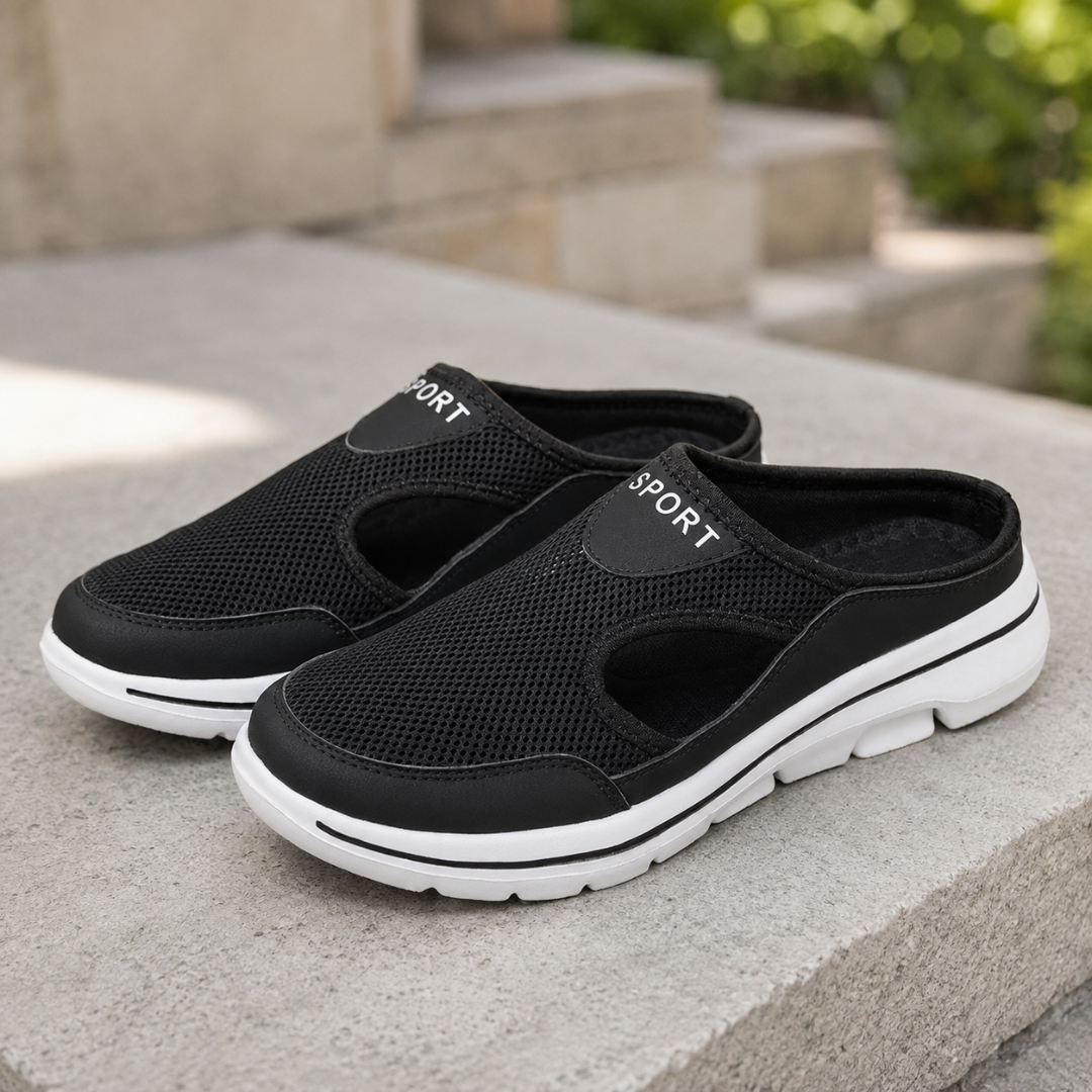 Mules noires à talon ouvert, tige perforée et semelle blanche contrastée
