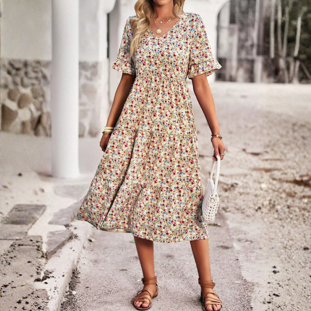 Robe abricot imprimé fleuri, coupe évasée mi-longue, vue de profil