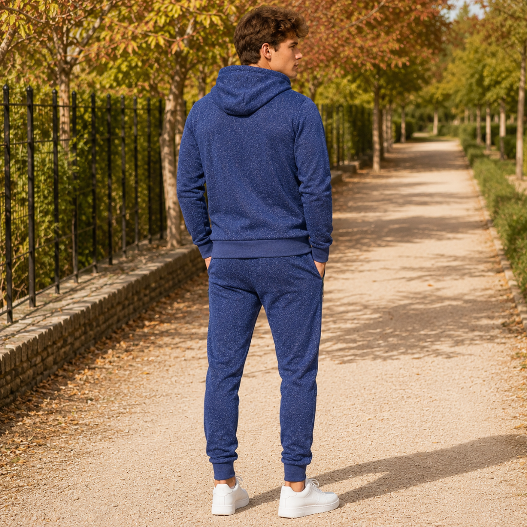Vue de dos du survêtement homme bleu avec capuche et bords côtelés à la taille