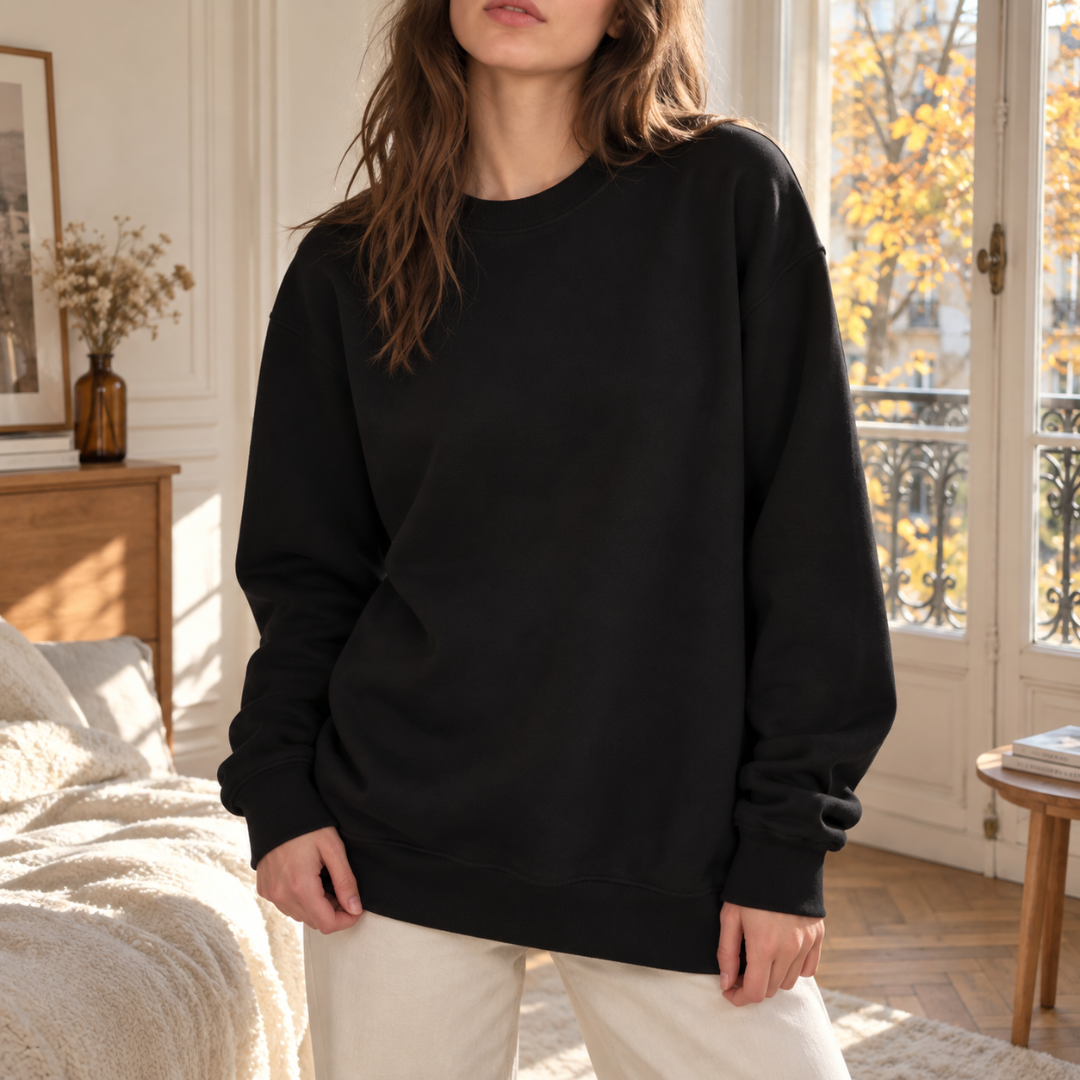 Sweat femme noir uni à col rond côtelé, manches longues et poignets côtelés