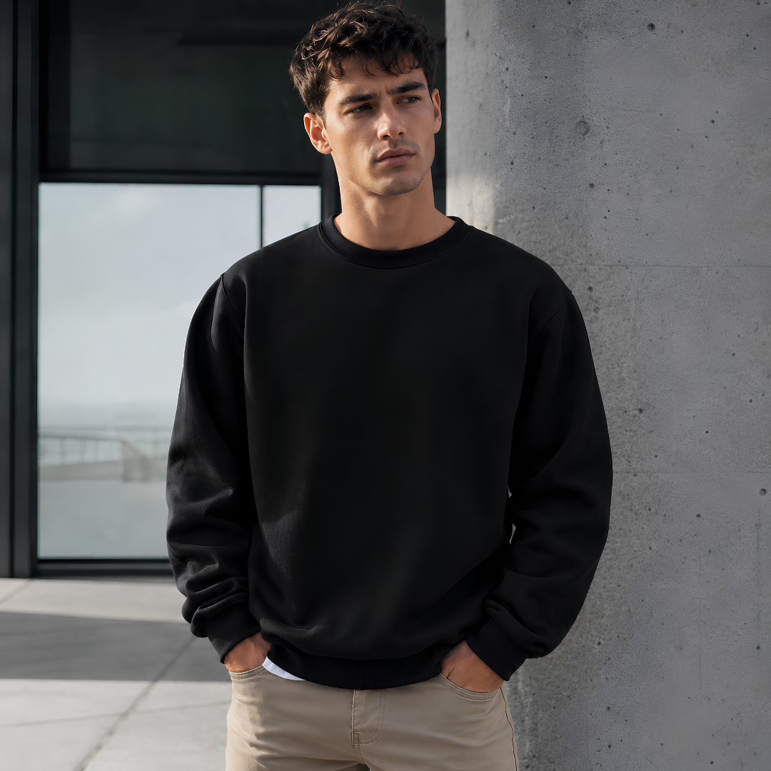 Sweat homme noir à manches longues, col rond côtelé et finition côtelée