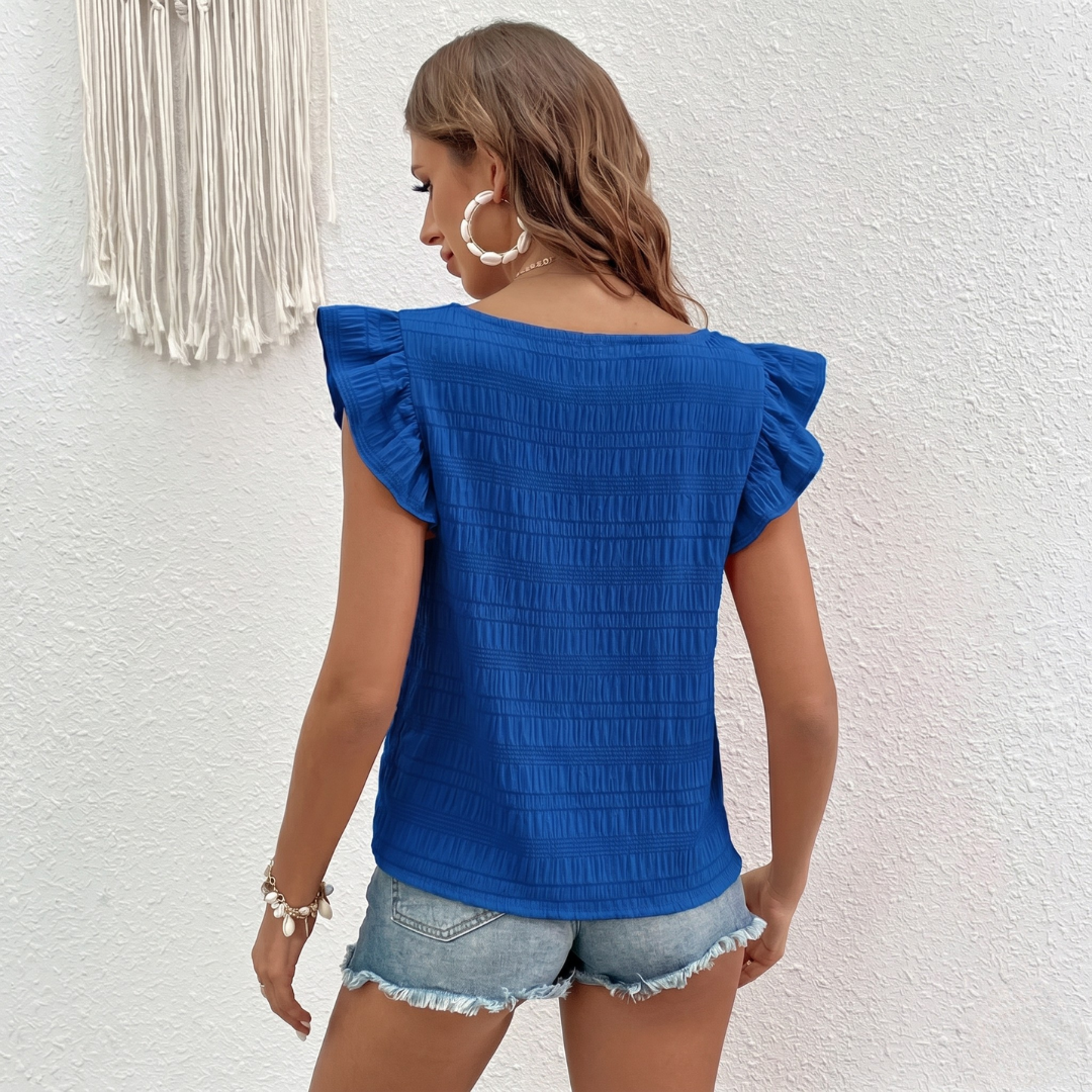 Top Rosalie bleu roi porté avec short en jean, vue de dos