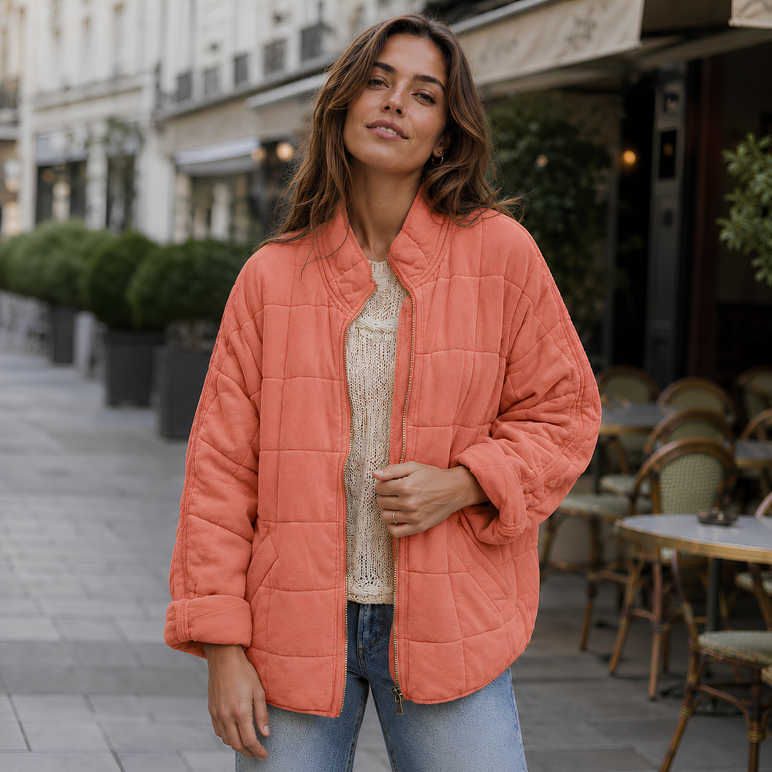 Veste matelassée terracotta à col montant, zip doré et surpiqûres carrées