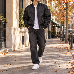 Blouson bomber homme noir zippé, poignets côtelés et poche sur la manche