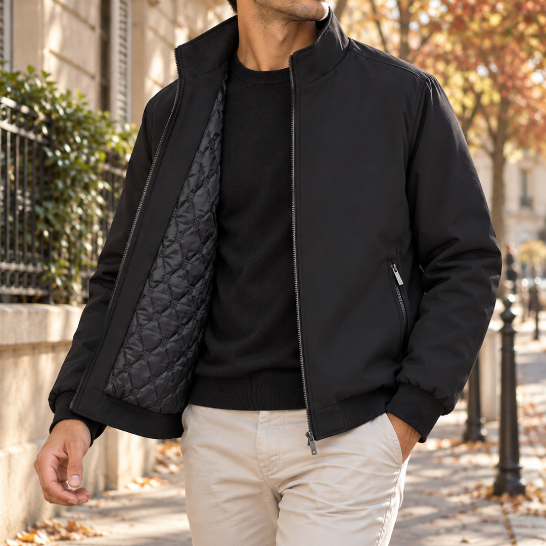 Blouson bomber homme noir ouvert, intérieur matelassé et poignets côtelés