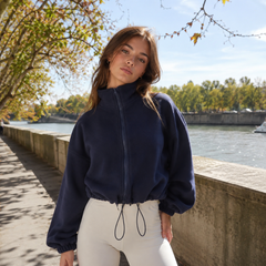 Blouson court bleu marine à col montant zippé et cordon au bas