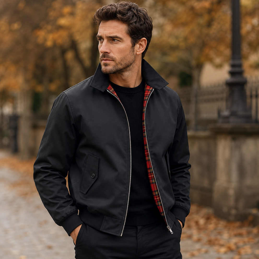 Blouson homme noir ouvert révélant la doublure à carreaux rouges et le zip argenté