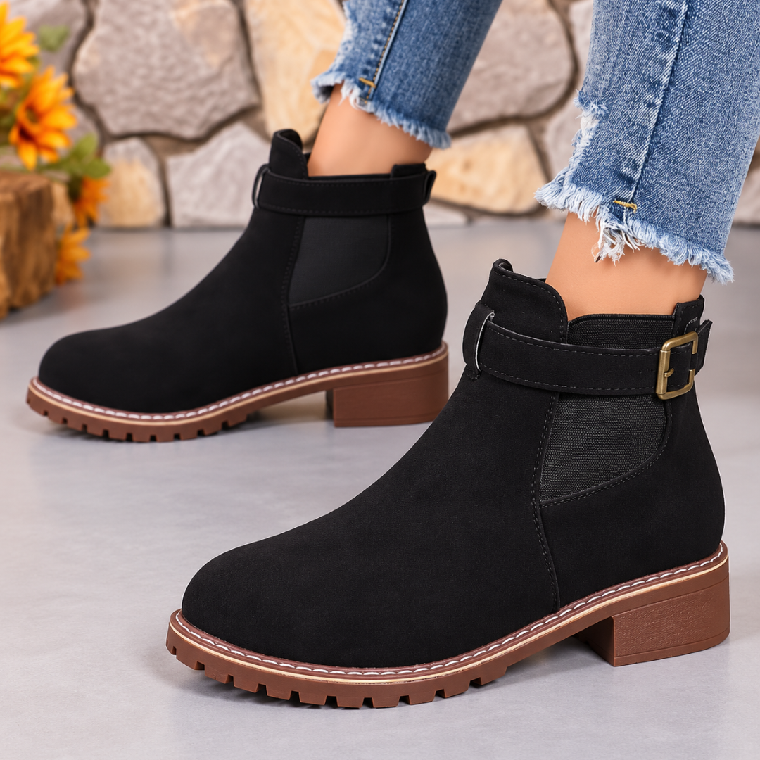 Bottines femme noires à bride et boucle dorée, semelle crantée contrastée