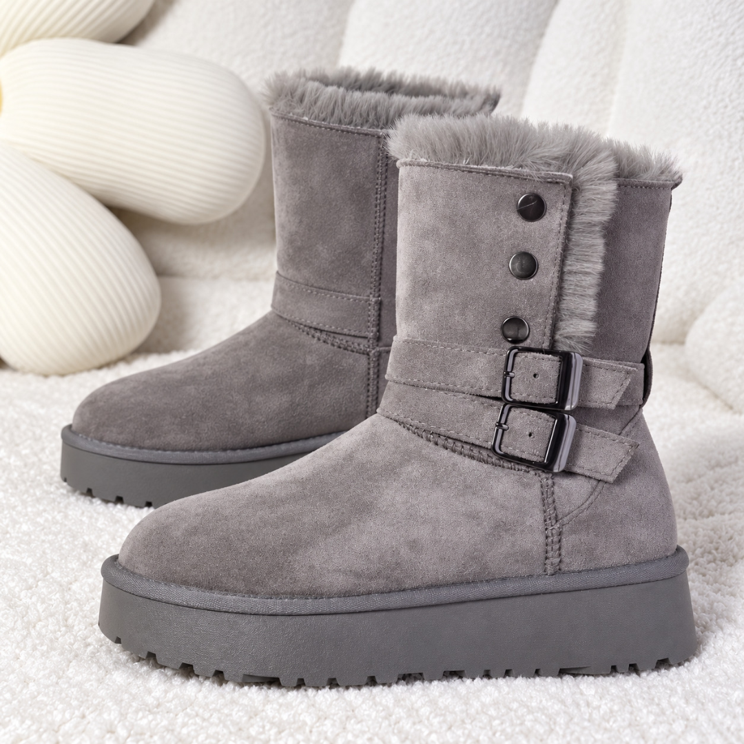 Paire de bottines grises de trois quarts, brides à boucles et bout rond