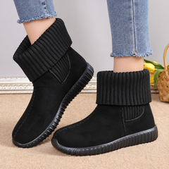 Paire de bottines noires montantes avec large revers tricoté et bout rond