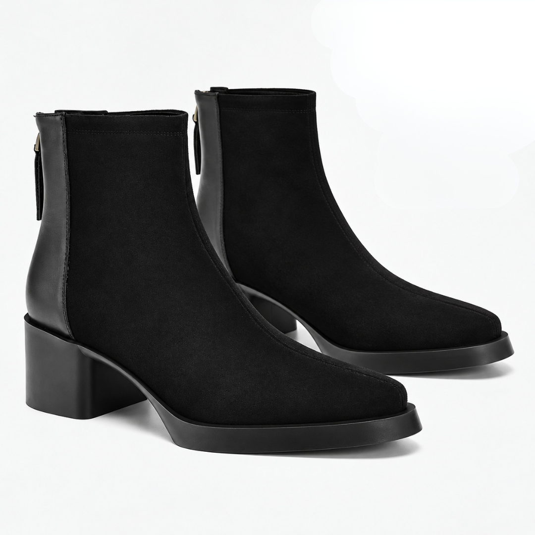 Paire de bottines noires en biais, semelle à fin plateau et tige nette