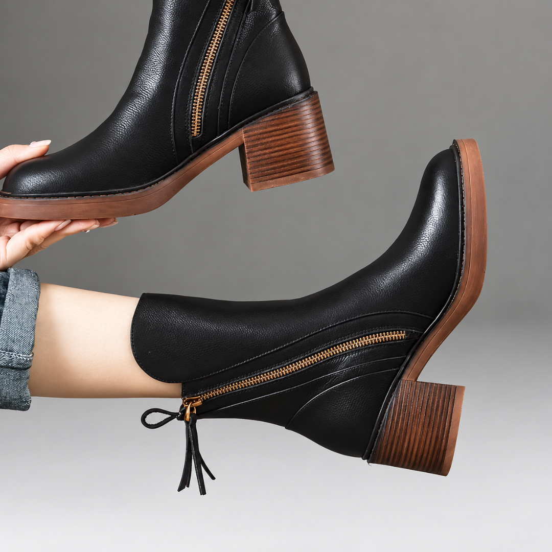 Bottines noires à talon bloc, zip doré en diagonale et tirant à franges