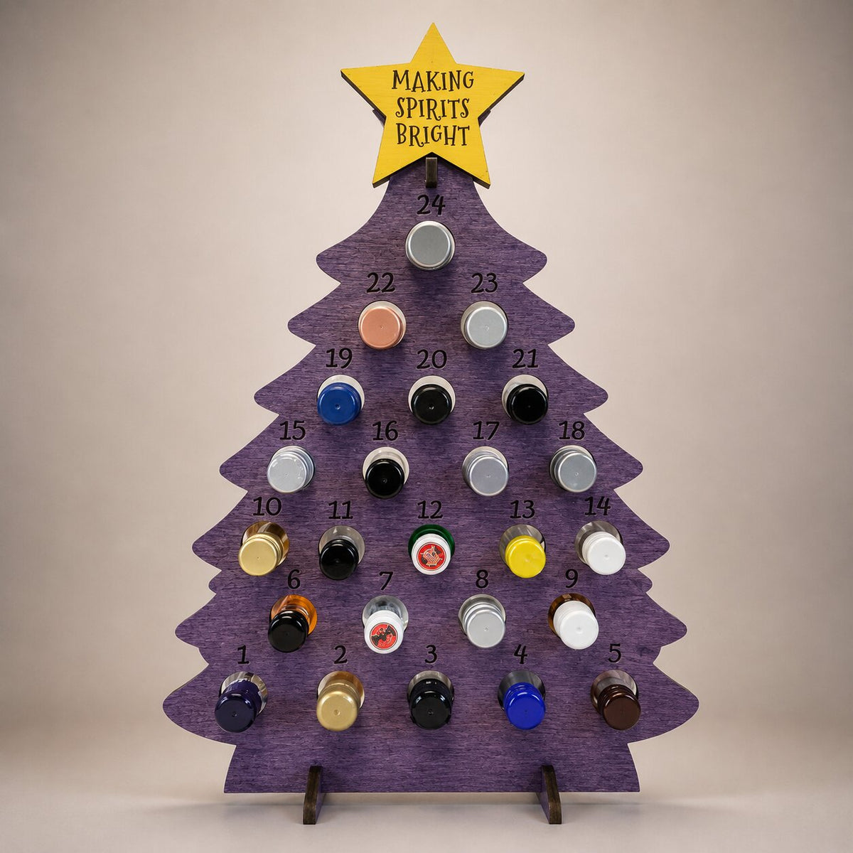 Calendrier de l'Avent sapin lilas avec étoile jaune gravée et mini-bouteilles numérotées