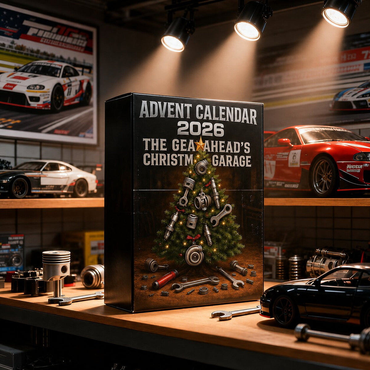 Boîte du calendrier de l'Avent posée sur un établi entouré de voitures miniatures