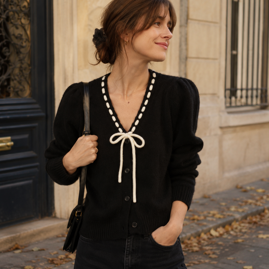 Cardigan noir col V avec surpiqûres crème et long nœud devant