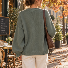 Dos du cardigan vert en maille unie avec bord côtelé et manches ballon