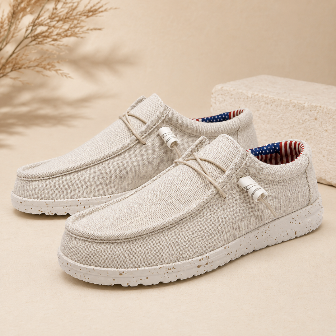 Chaussures homme slip-on blanches à lacets élastiques et semelle mouchetée, vue trois quarts