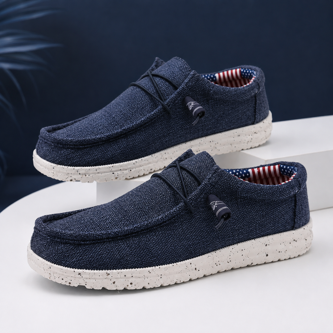 Chaussures homme bleu marine slip-on, lacets élastiques sombres et semelle claire mouchetée