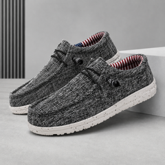 Chaussures homme gris foncé chinées, col rembourré rayé et semelle blanche crantée