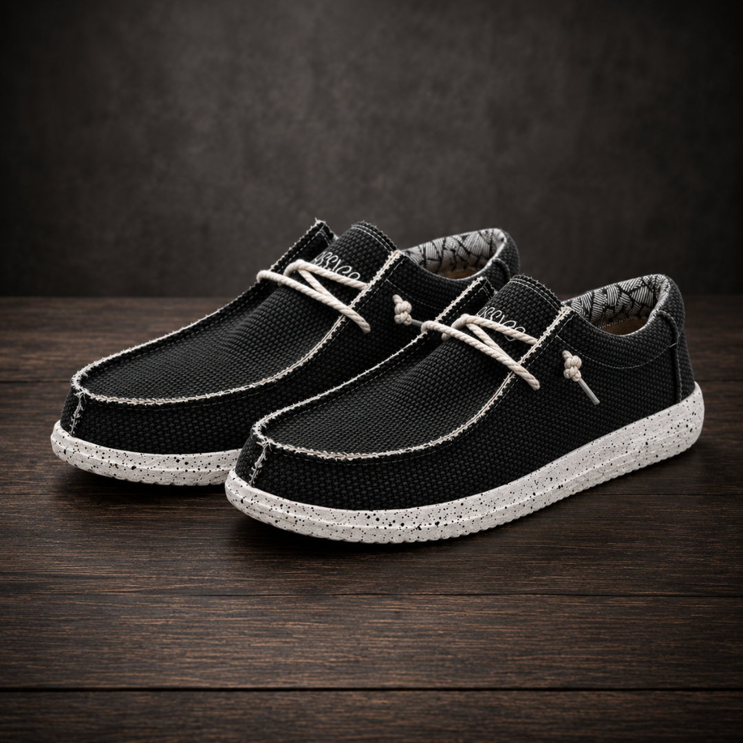 Chaussures homme slip-on noires au tissage texturé et semelle blanche mouchetée