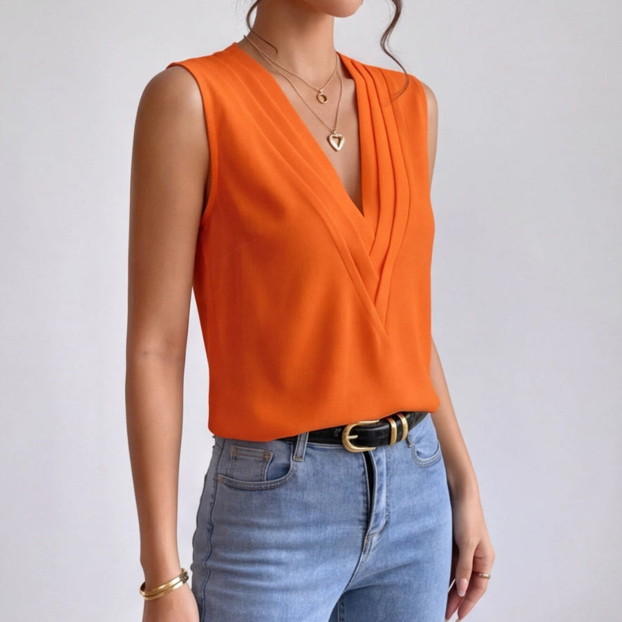 Chemisier orange col V croisé porté avec un jean, vue de trois quarts