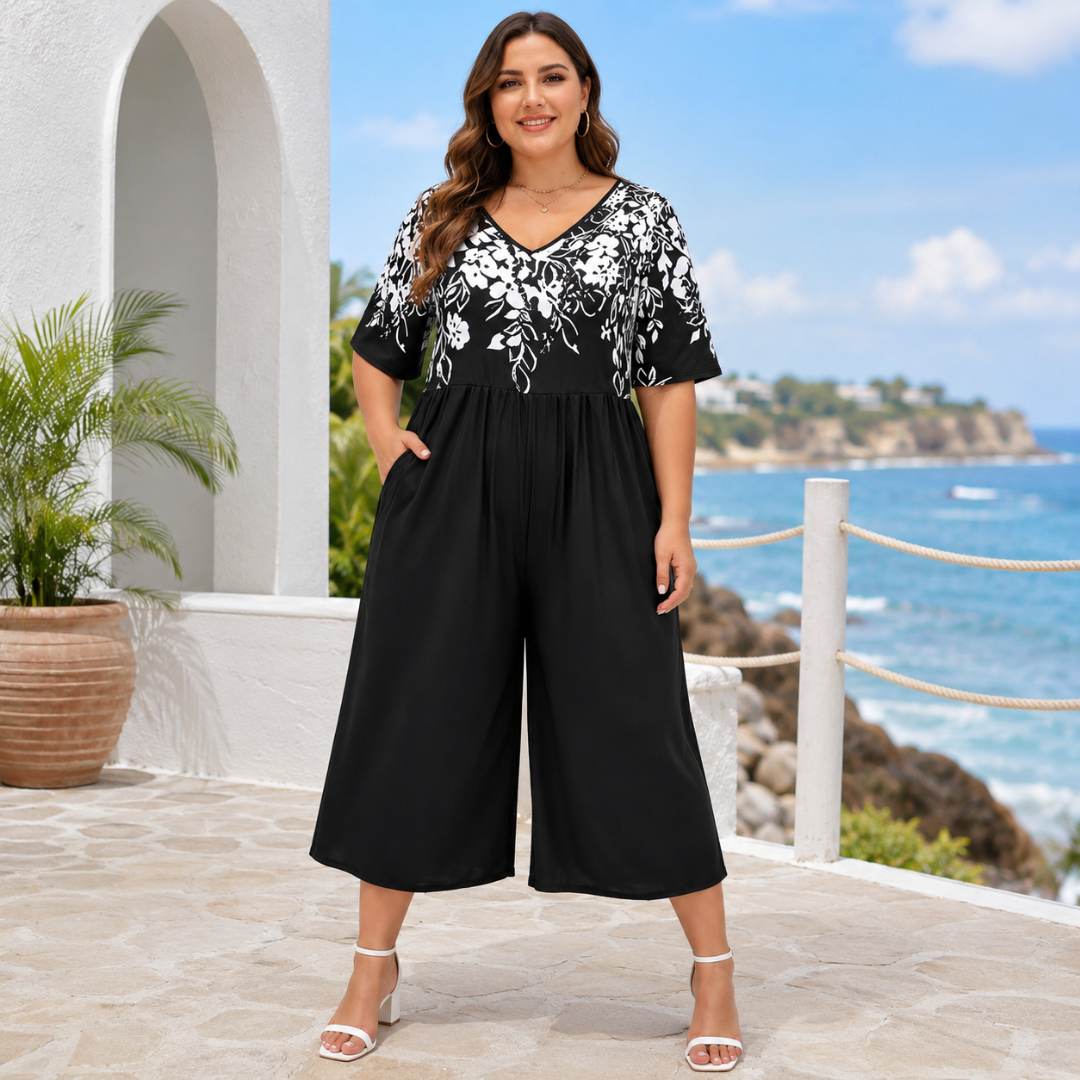 Combinaison noire au buste fleuri blanc et col V, jambes larges avec poches