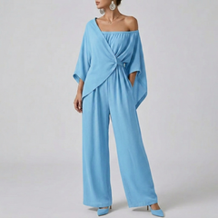 Combinaison femme bleu clair épaule asymétrique nœud décoratif vue face