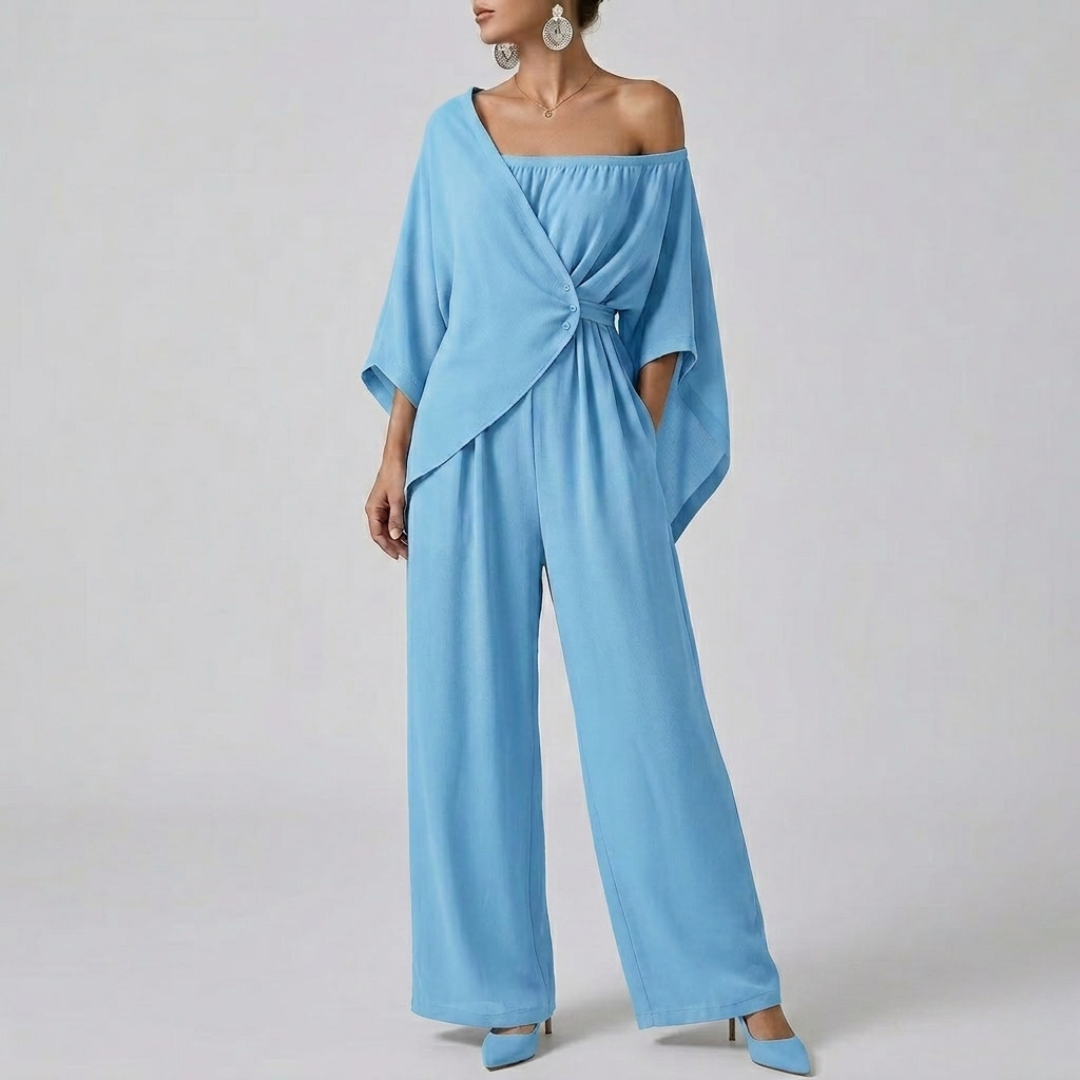 Combinaison femme bleu clair épaule asymétrique nœud décoratif vue face