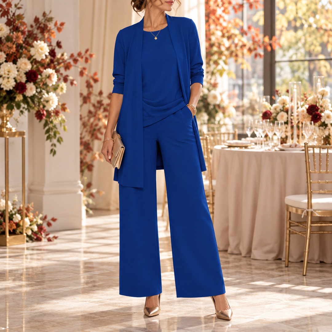 Ensemble bleu roi, veste longue ouverte et pantalon large à pli marqué