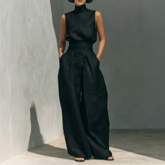 Ensemble deux pièces noir vue de face, top sans manches col montant et pantalon large