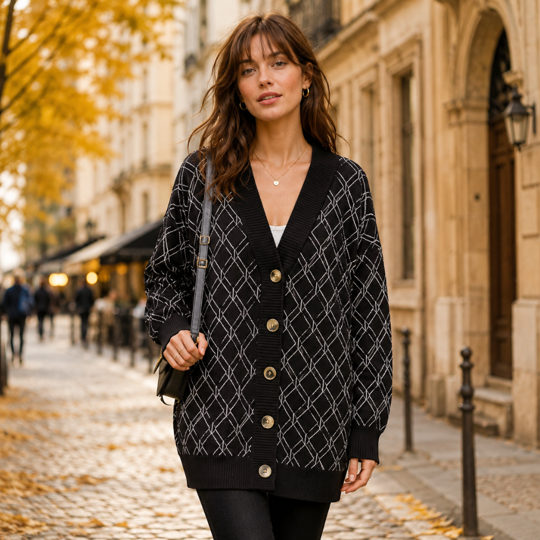 Gilet noir à losanges contrastés blancs, col V et boutons dorés devant