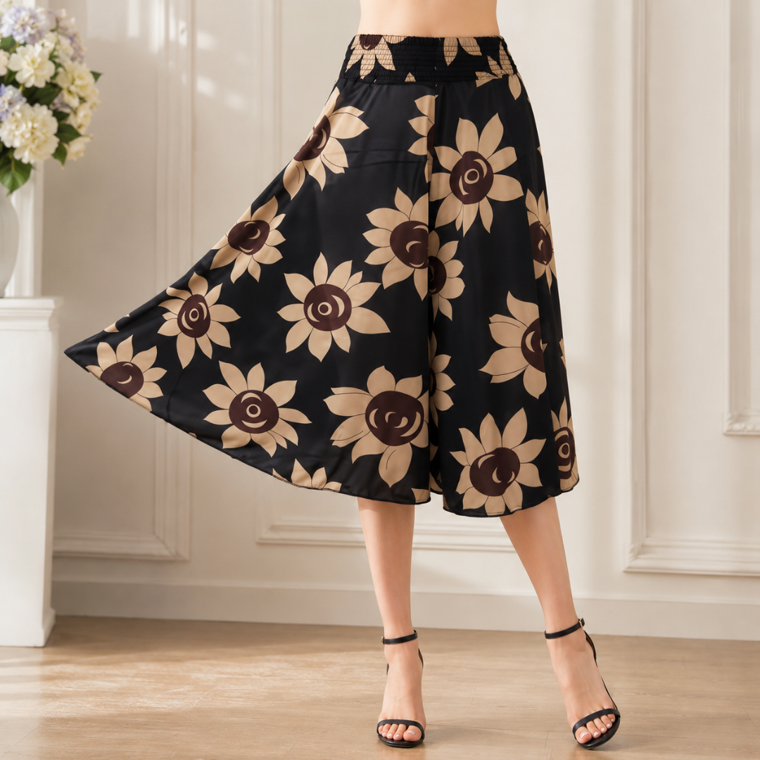 Jupe-culotte noire à grands tournesols beiges et bruns, large silhouette