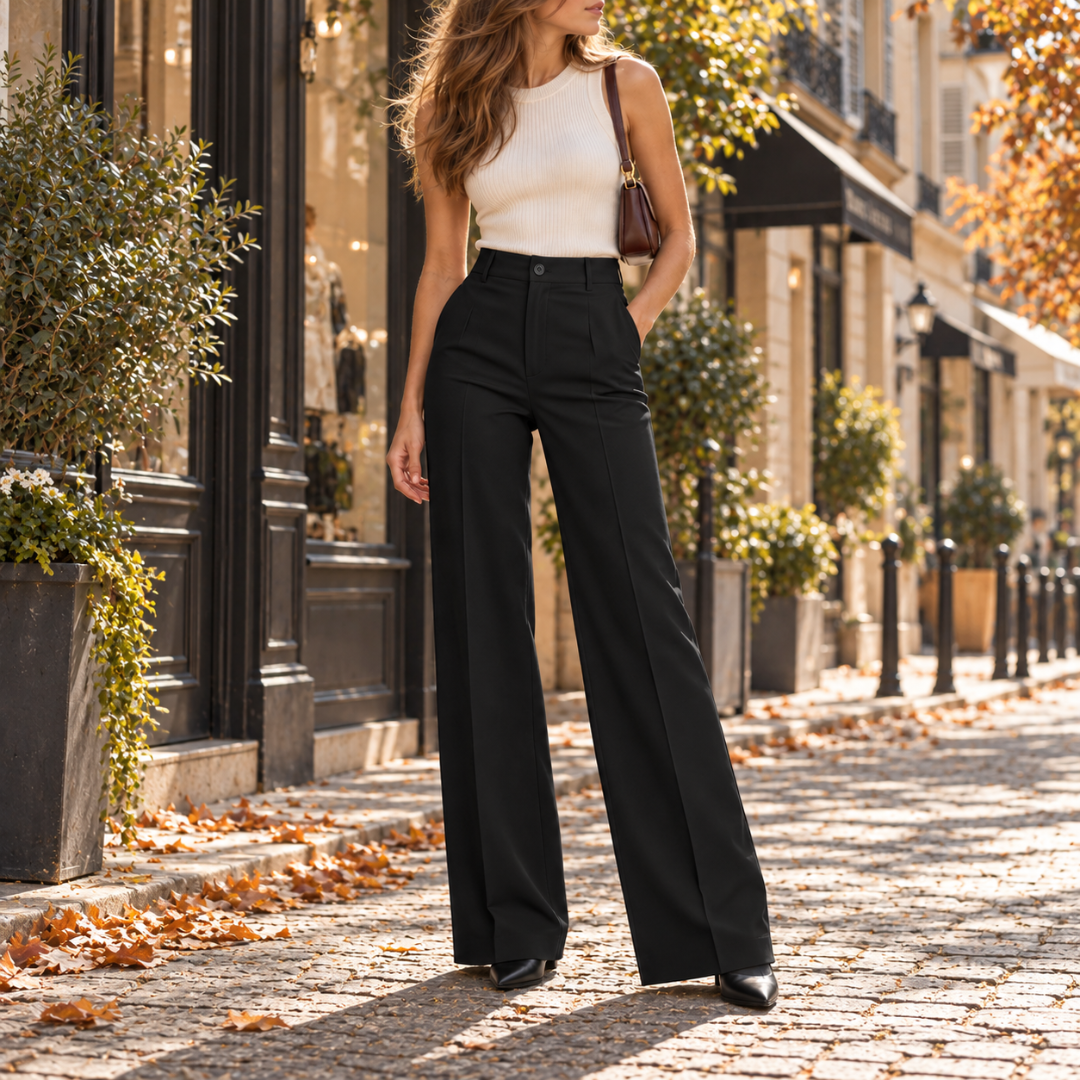 Pantalon large noir taille haute, pli central net et bottines noires