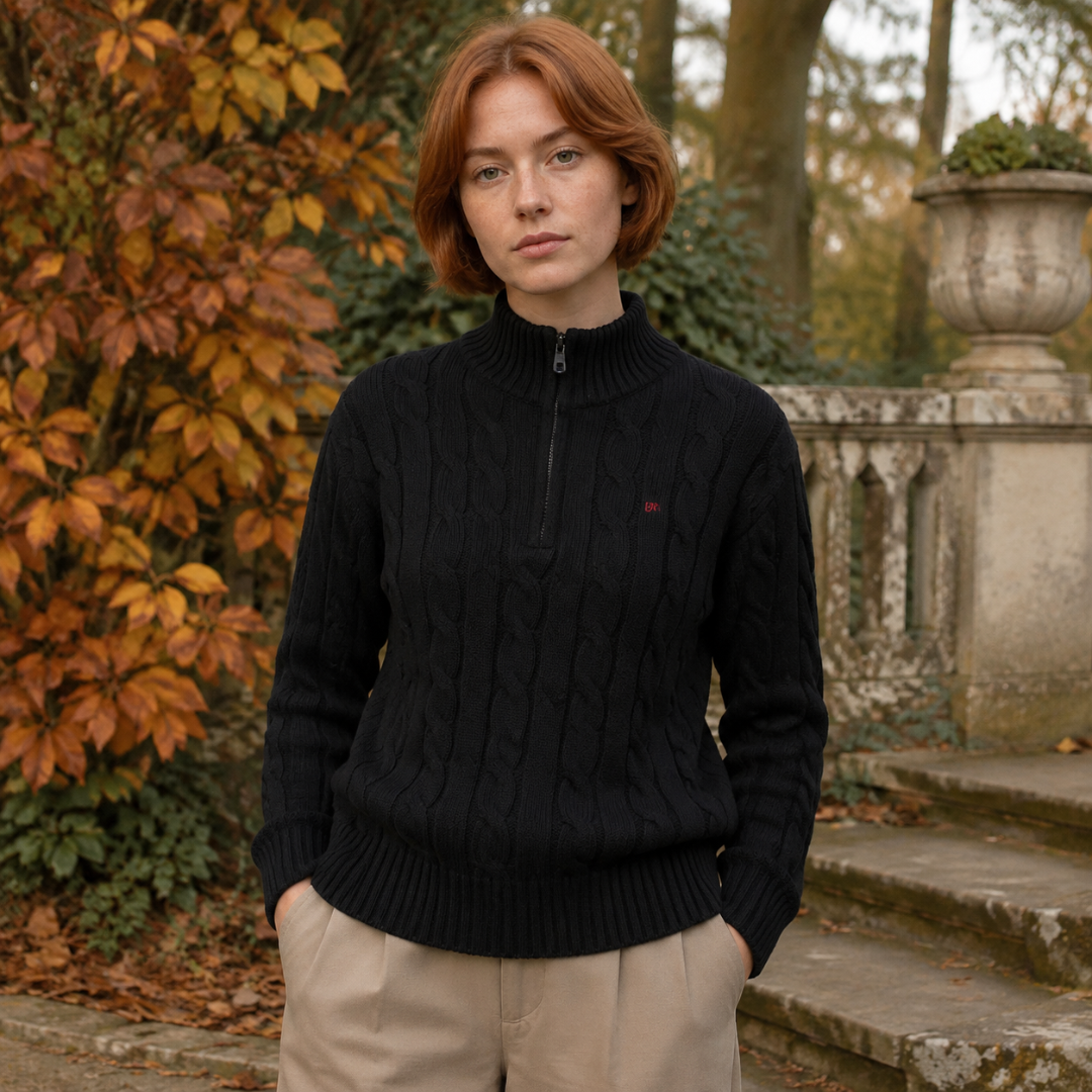 Pull femme noir en maille torsadée, col montant côtelé et fermeture demi-zip