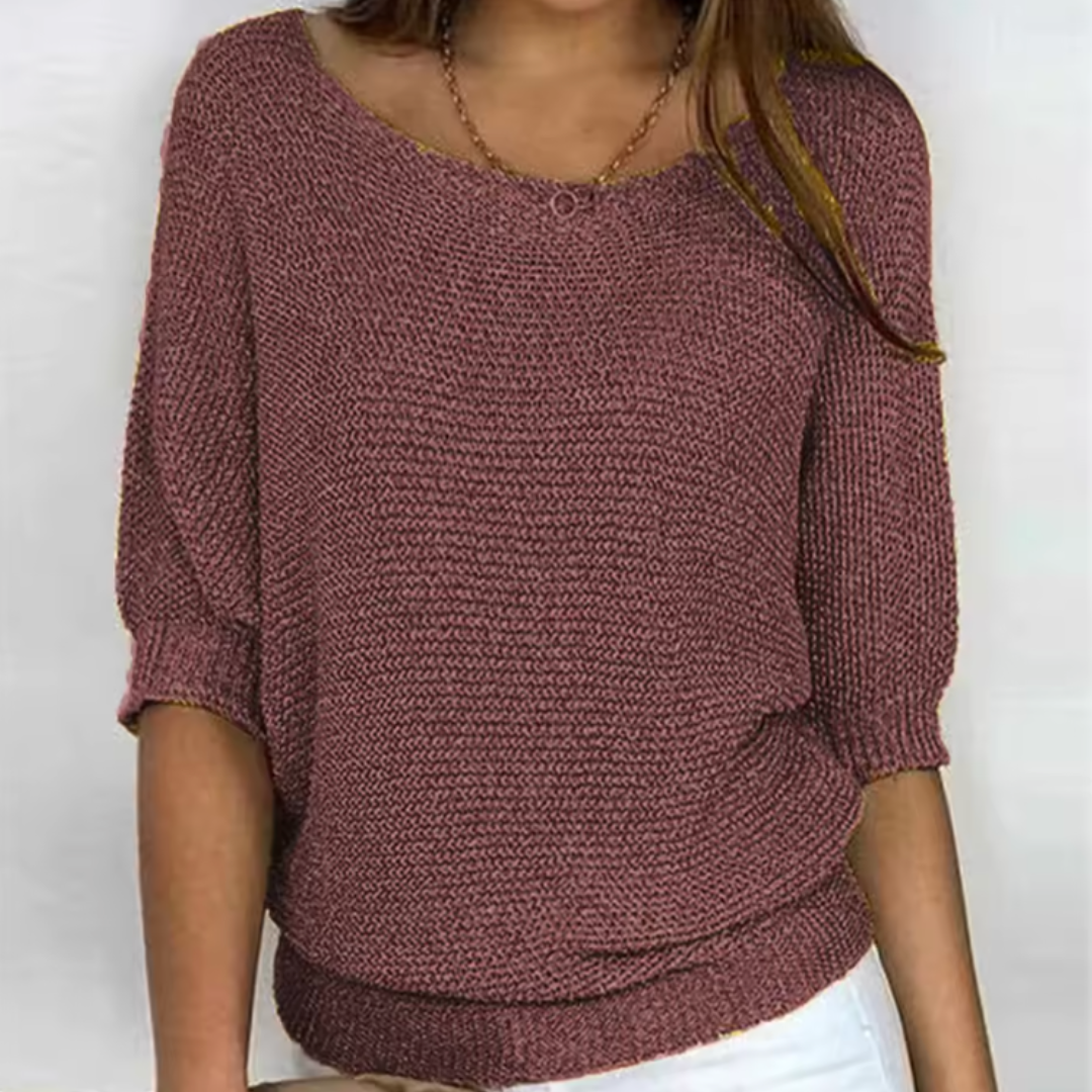 Pull femme marron foncé en maille, encolure bateau et manches chauve-souris