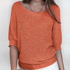 Pull femme orange à col bateau et manches chauve-souris en maille tricotée