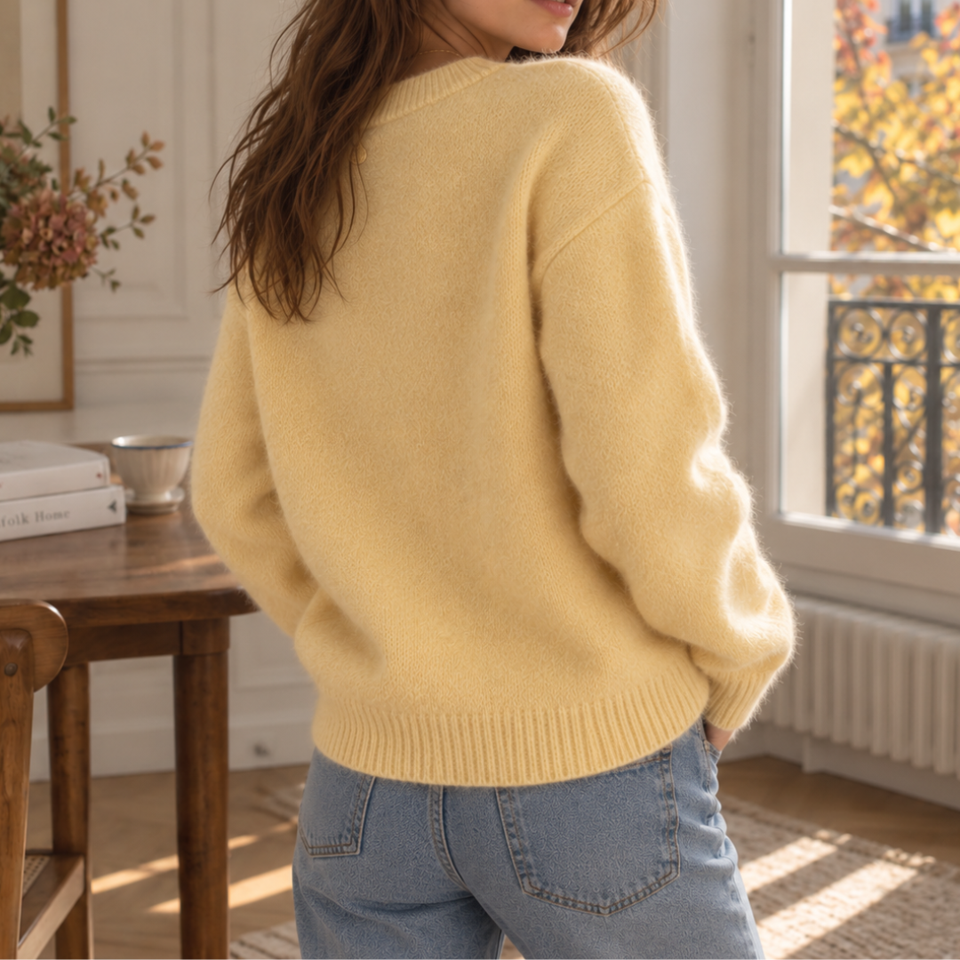 Dos du pull femme jaune en maille unie avec bord côtelé à la base