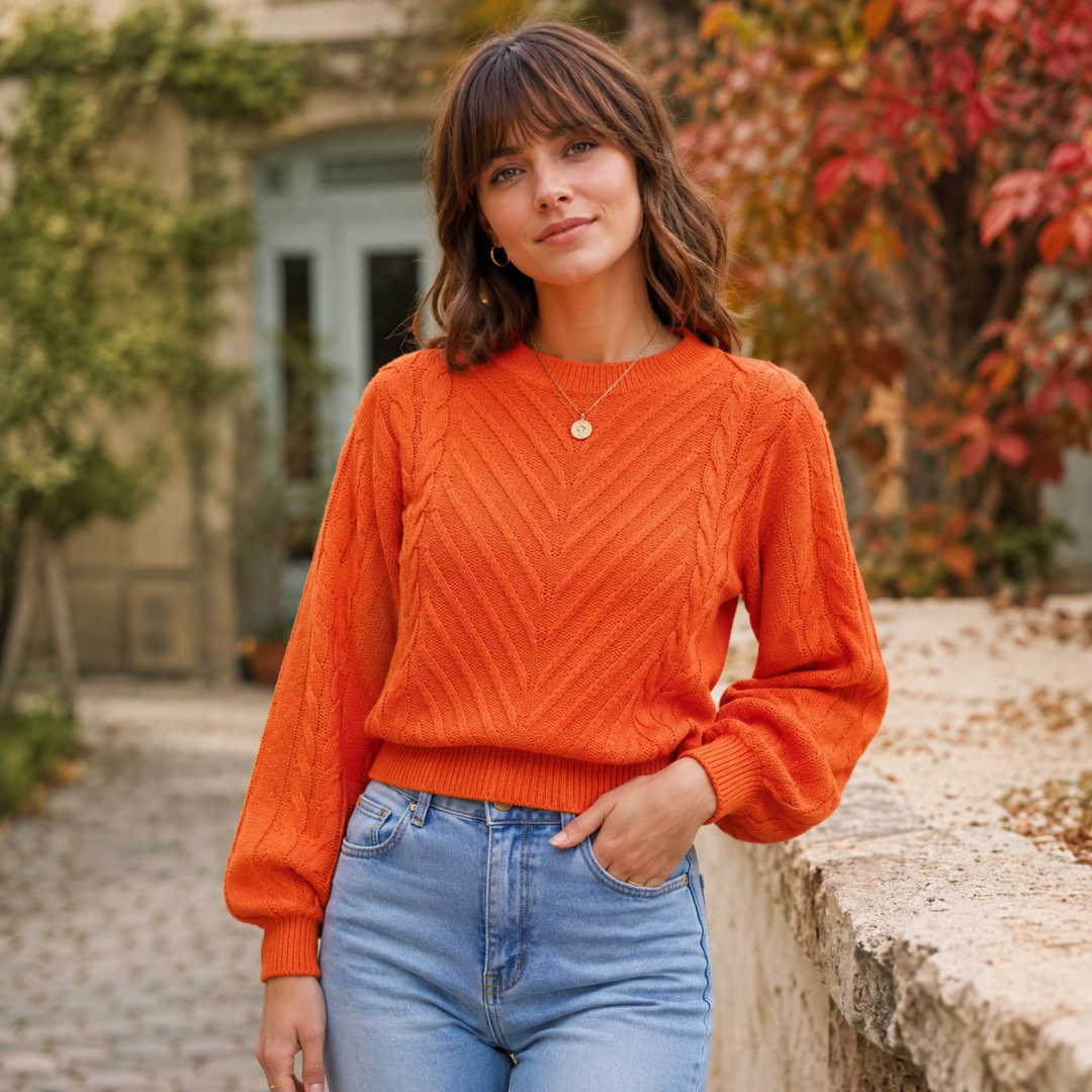 Pull femme orange torsadé à col rond, manches longues et poignets côtelés