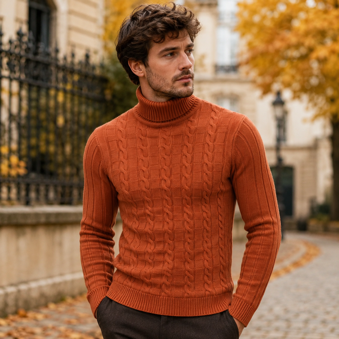 Homme portant un pull orange à torsades, col roulé et manches longues