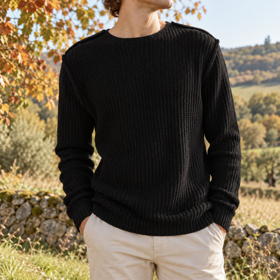 Pull homme noir en maille gaufrée, col rond et coutures d'épaule visibles